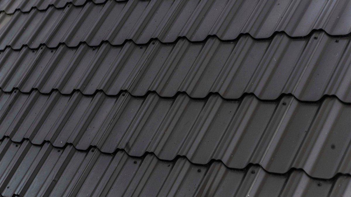 Close-up of dark architectural asphalt shingles on a residential roof