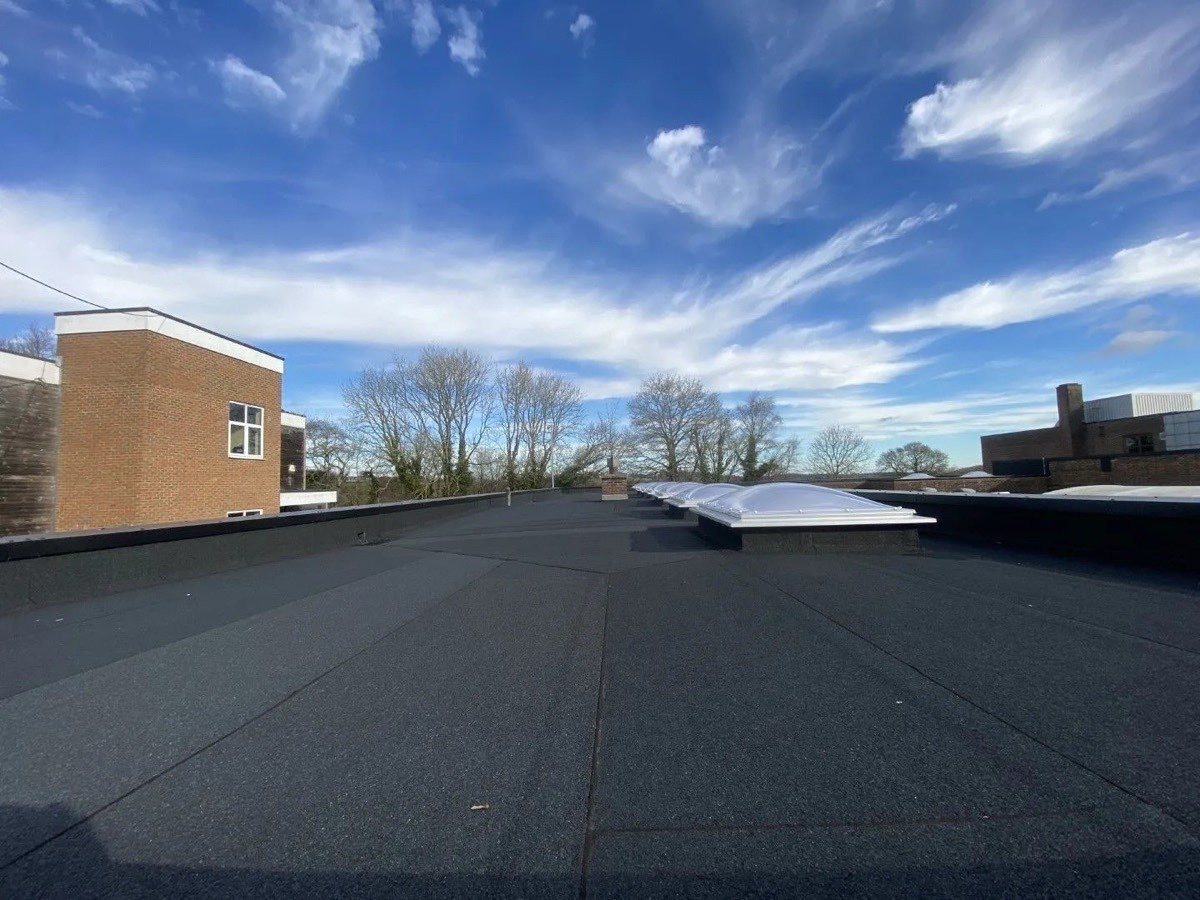 IKO commercial roof replacement materials staged on a flat roof in Edmonton