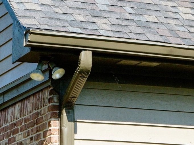 Gutter and downspout installation on a residential home
