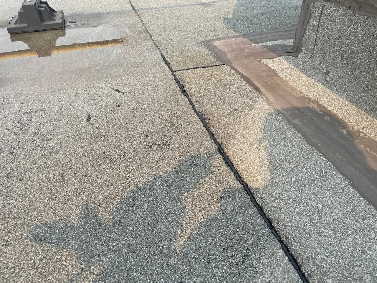 Sealed seam and flashing on the commercial roof