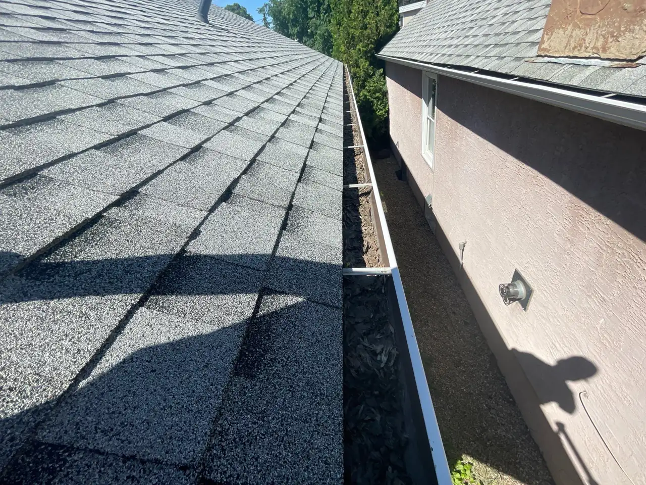 Cleaned-out gutter running along the roofline of an Edmonton home