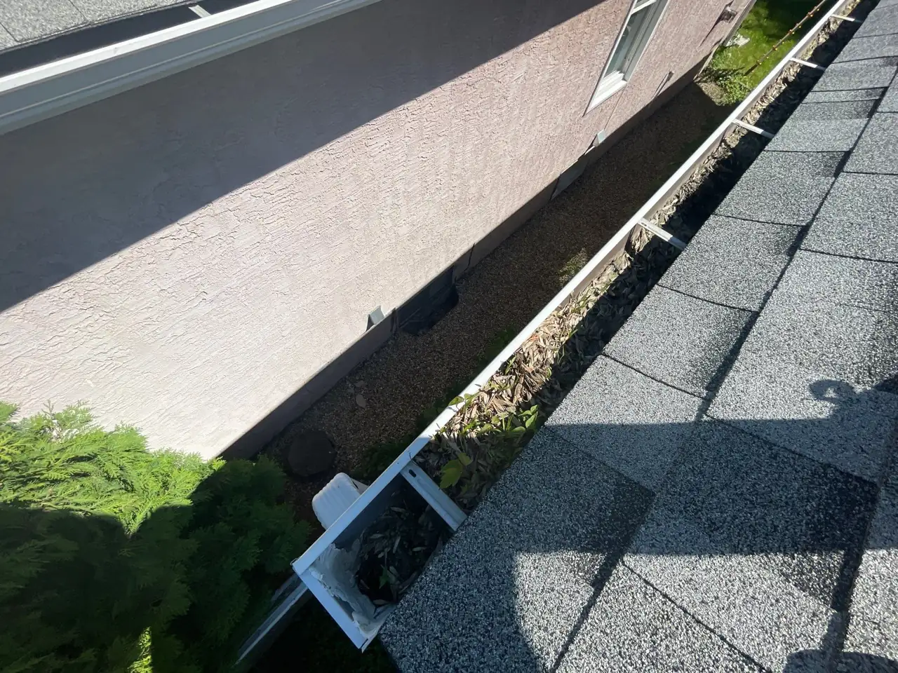 Gutter and roof edge checked for proper flow