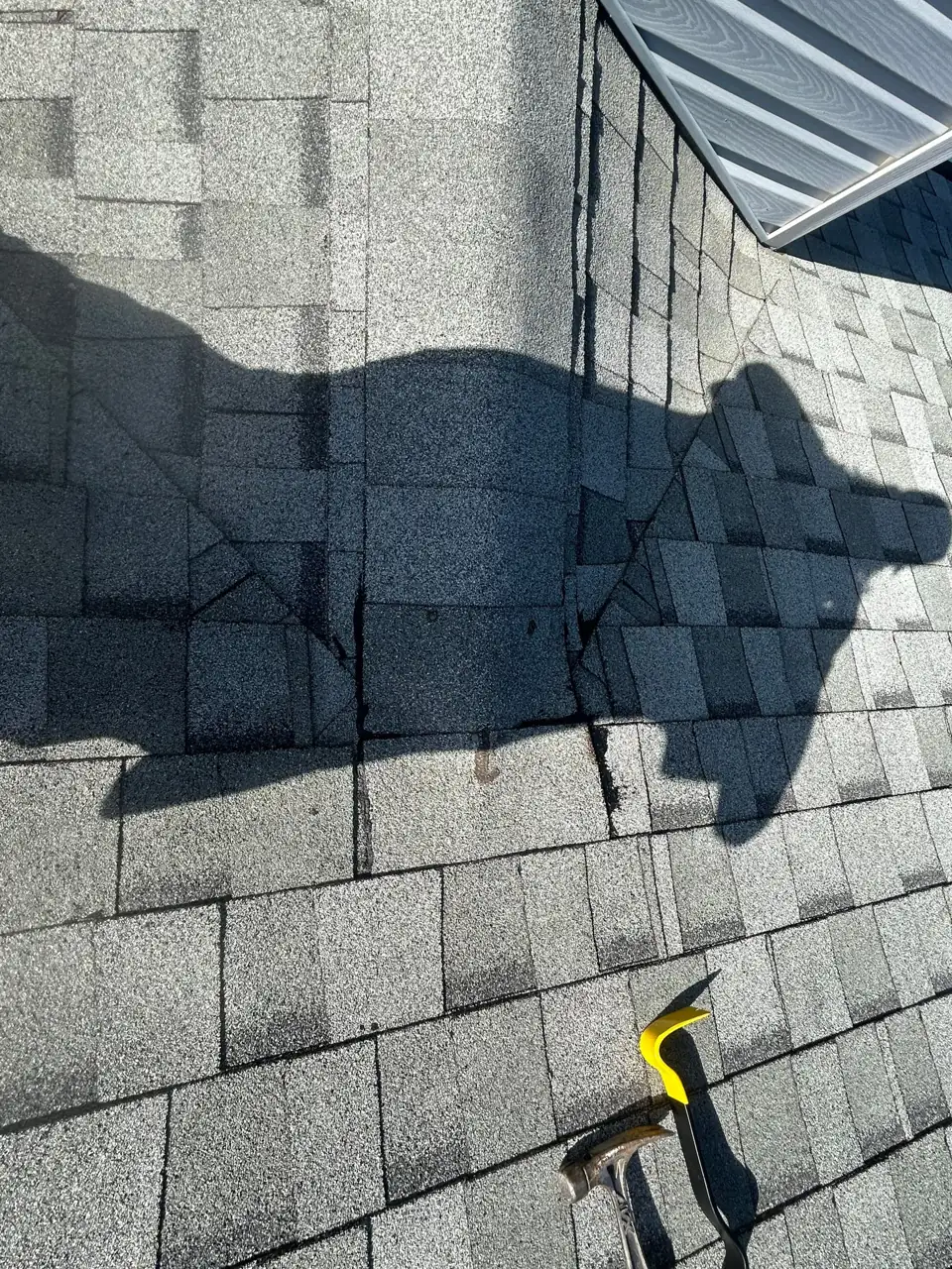 Inspecting the shingles and a roof valley up close