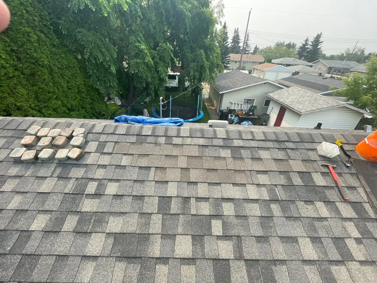 New shingles installed and being sealed