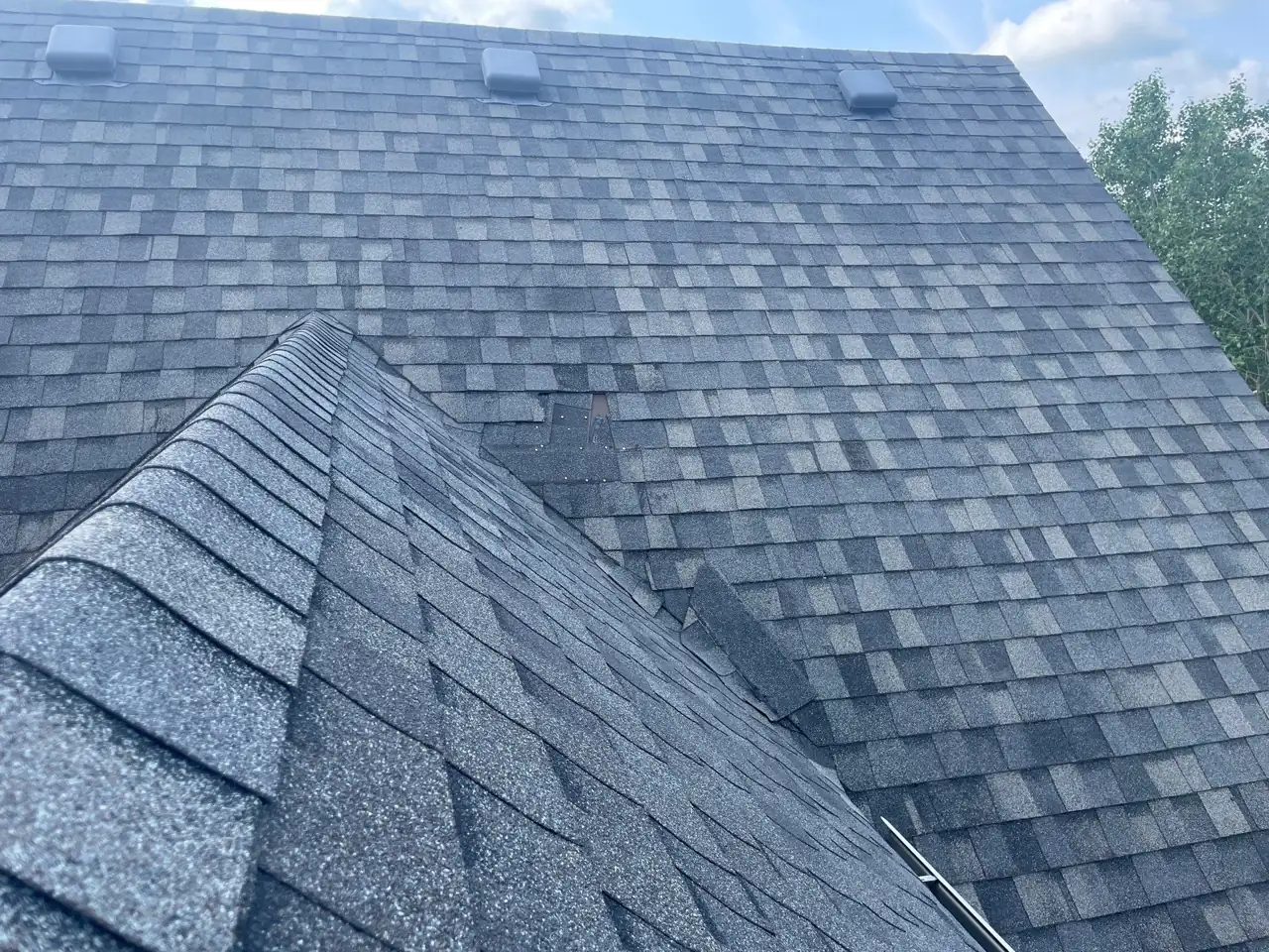 Blown-off shingles leaving the roof exposed