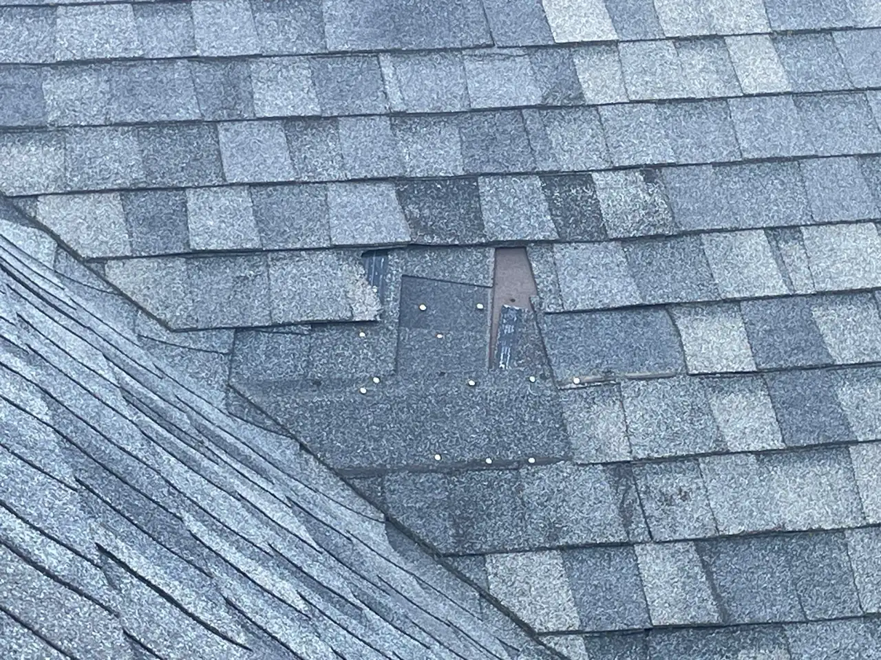 Installing new shingles to match the roof