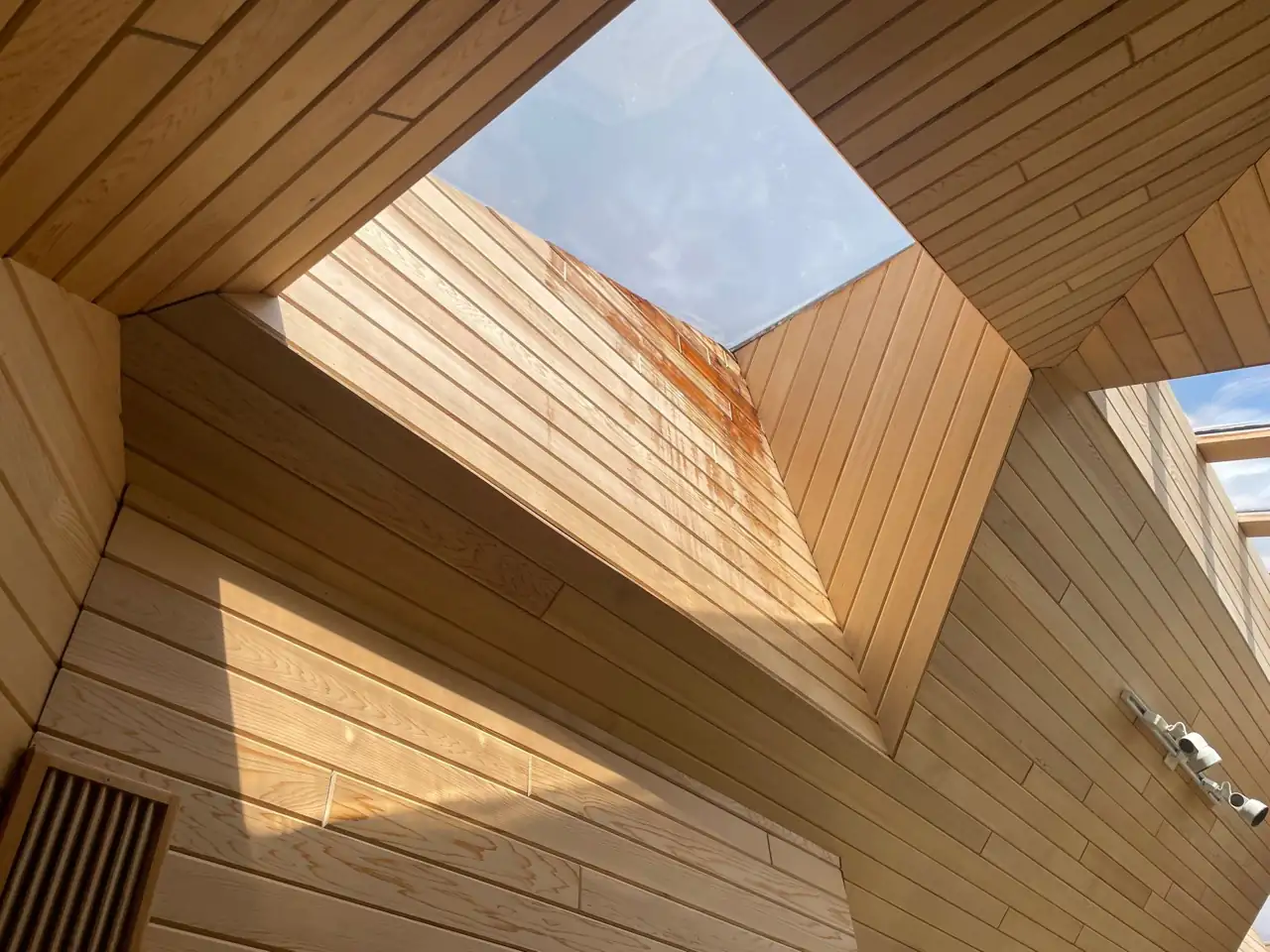 Skylight in a cedar-lined ceiling in St. Albert that was leaking and staining the wood