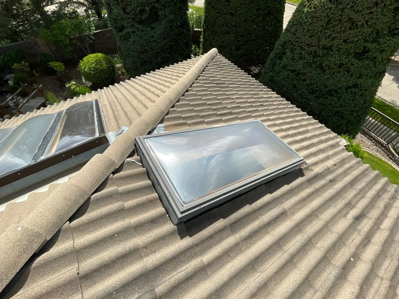 Assessing the skylight and surrounding roof on the exterior