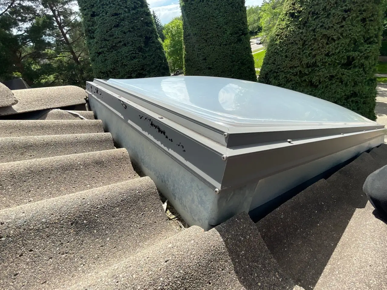 Cleaning and prepping the skylight perimeter for sealing